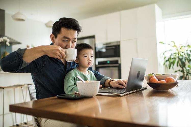 Happy remote worker demonstrates the positive impact working remote has on families