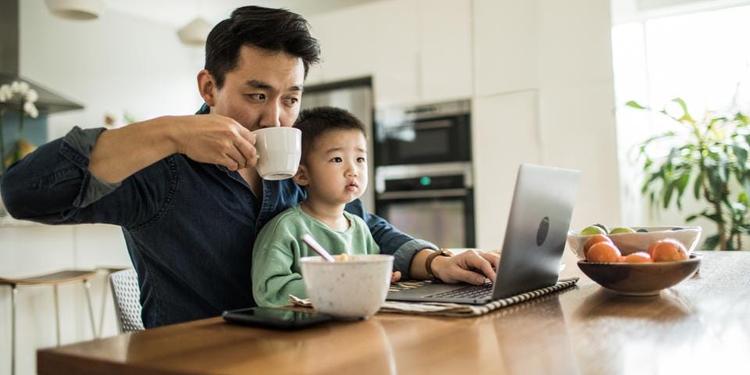 Happy remote worker demonstrates the positive impact working remote has on families